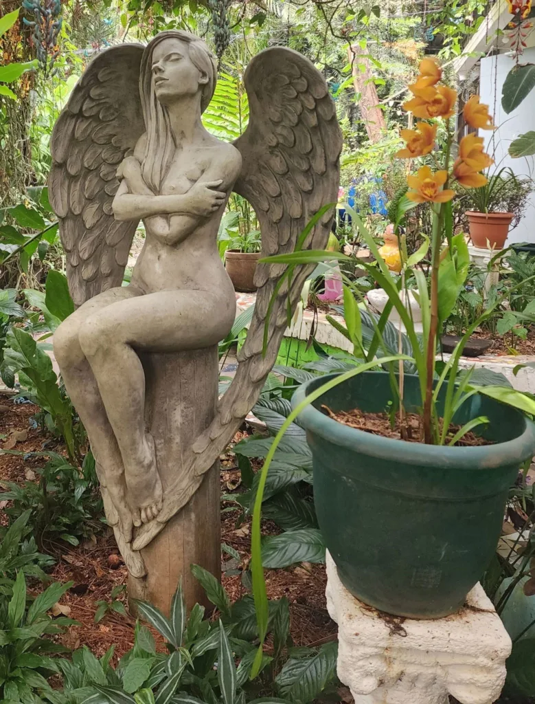 Like all naked angels sitting in a garden that I've met, she wouldn't talk to me either.